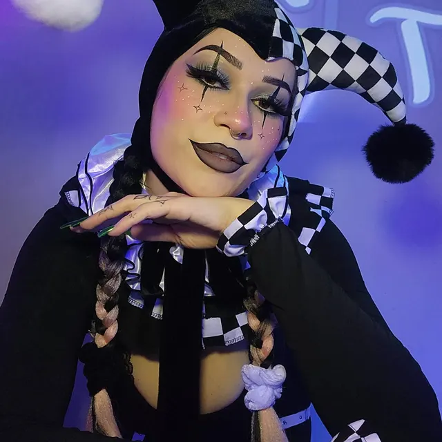 Customer wearing the black and white checkered jester bonnet