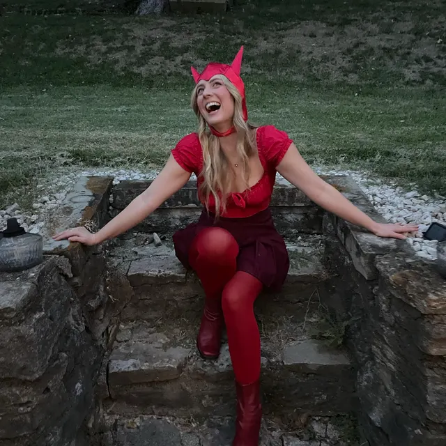 Customer outdoors wearing the red devil bonnet